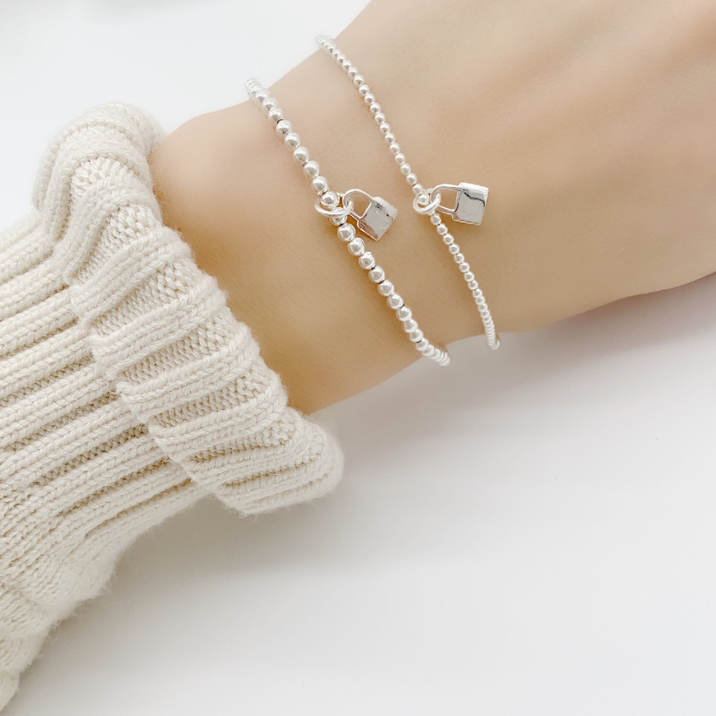 Discover the perfect way to add a personal touch to any outfit with an Initial charm bracelet. This beautiful bracelet features a stylish initial charm, crafted from high-quality sterling silver. 